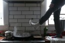 Foot hanging over a hot stove