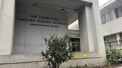 A large grey building with the words "San Francisco Unified School District Administrative Offices."