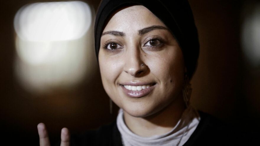 Bahrain human rights activist Maryam al-Khawaja flashes the V-sign for "Victory" after she was released from detention on September 18, 2014, in the city of Muharraq, north of capital Manama.