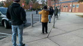 Voters line up at a polling place at Wilbur Cross High School in New Haven on Nov. 3, 2020.