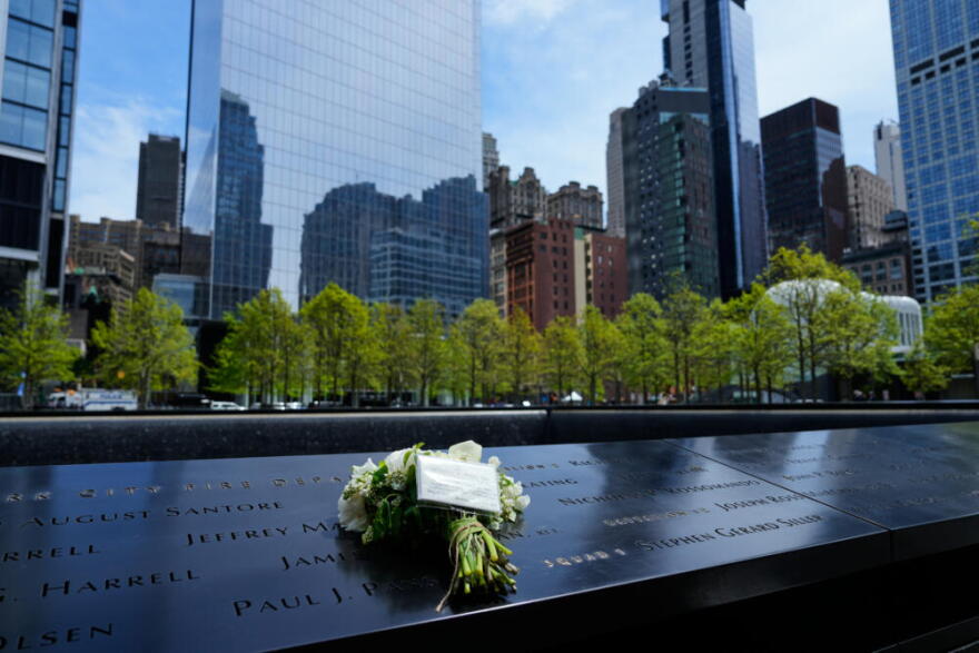 Flowers from Britain's King Charles III and Queen Camilla are seen at the 9/11 Memorial, Wednesday, April 29, 2026, in New York. (Yuki Iwamura/AP)