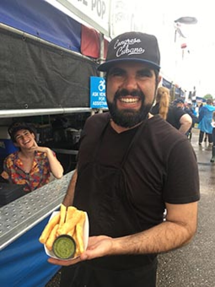 Orlando Vega At Congreso Cubano booth w/yucca fries & chimichurri.