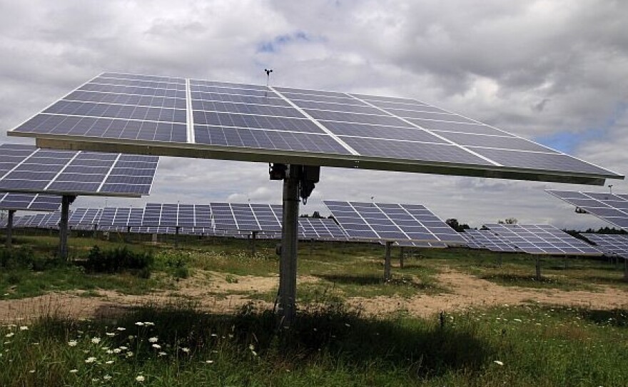 Solar trackers installed in South Burlington in a field on a cloudy day are pictured in this July 27, 2011