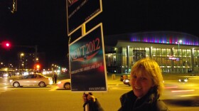 State Representative Laurie Pettengill waves signs for Newt Gingrich outside of the Verizon Center.