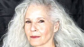 Woman with long gray hair in side profile