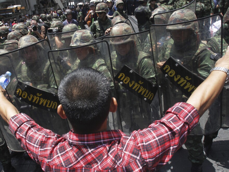 An anti-coup demonstrator in Bangkok, earlier this week. The country's new military leader says those opposed to the putsch lack an understanding of democracy.