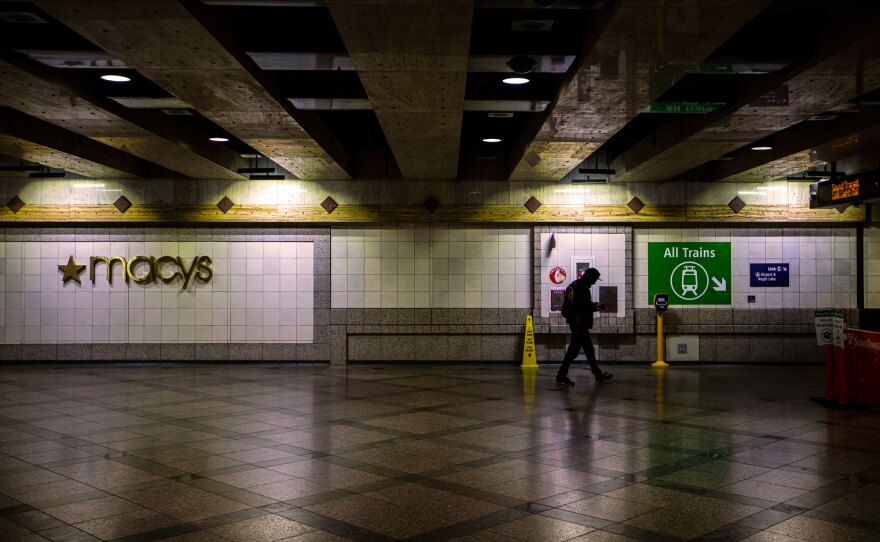 Few people are seen at the Westlake light rail station, since Gov. Jay Inslee ordered many public places to close in response to the coronavirus outbreak.