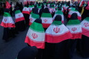 Women draped in Iranian flags march during the state-organized "Janfada," or "Sacrifice for Iran," military-style parade in Tehran, Iran, on Sept. 18, 2026.
