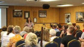 Prof. Linda Prokopy speaks to a crowd at Wolf Park about why people have the attitude they do toward climate change.