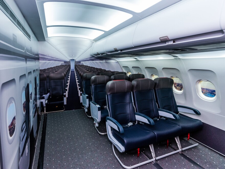 A replica of an airplane cabin in the sensory space includes airplane seats, trays, windows, seat belts and overhead compartments, to allow kids and adults to get used to the feeling of sitting on a plane.