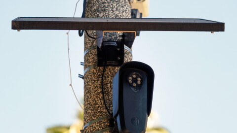 A Flock Safety camera is shown mounted to a light pole on August 03, 2026 in Beverly Hills, California. Flock Safety's automated license plate reader cameras have been deployed in over 120,000 locations across 49 states, using artificial intelligence to identify vehicles by their license plates, make, model and color to help law enforcement investigate crimes, while also drawing criticism from privacy advocates over concerns about mass surveillance and the collection of motorists' location data.