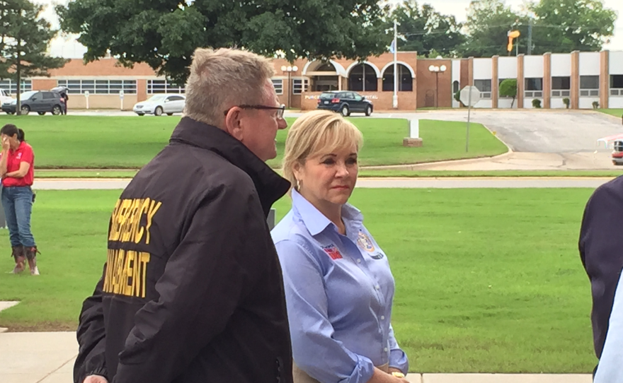 Gov. Mary Fallin and state emergency management director Albert Ashwood tour damaged areas in Purcell Wednesday morning.