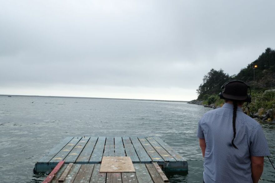 Barry McCovey, Fisheries Department director for the Yurok Tribe, stands on the tribe's fishing dock where the Klamath River meets the Pacific Ocean in 2021.