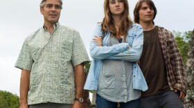 George Clooney as Matt King, Shailene Woodley as Alexandra King, and Nick Krause as Sid in <em>The Descendants.</em>