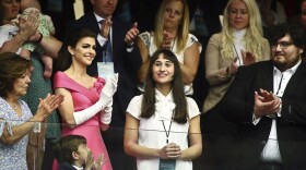 Chloe Cole, center, is recognized by Florida Gov. Ron DeSantis during a joint session for his State of the State speech Tuesday, Mar. 7, 2023 at the Capitol in Tallahassee, Fla. At left, is Florida first lady Casey DeSantis. Cole received puberty blockers when she was 13, and underwent a double mastectomy at 16. Now she is an advocate against allowing those procedures on children.