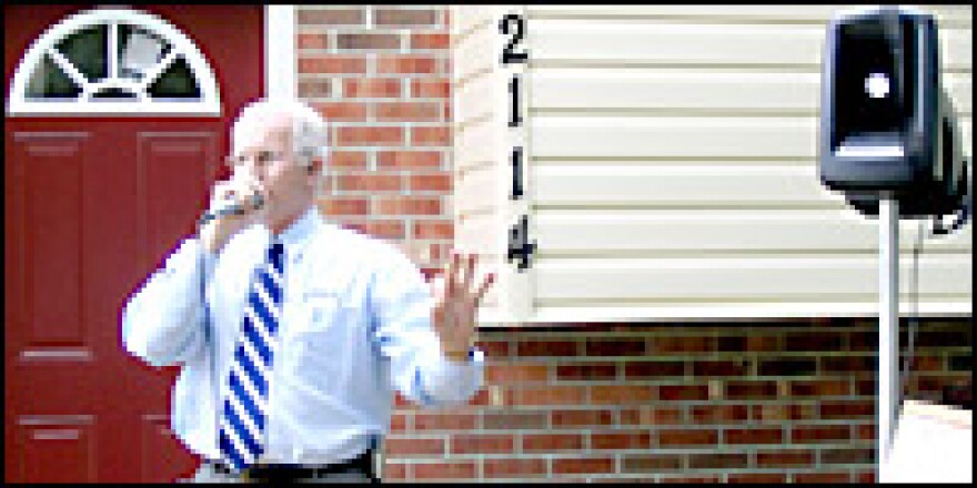 Auctioneer Charles Nicholls calls for bids at a home in Fredericksburg, Va. His firm's business is up about 60 percent over last year.