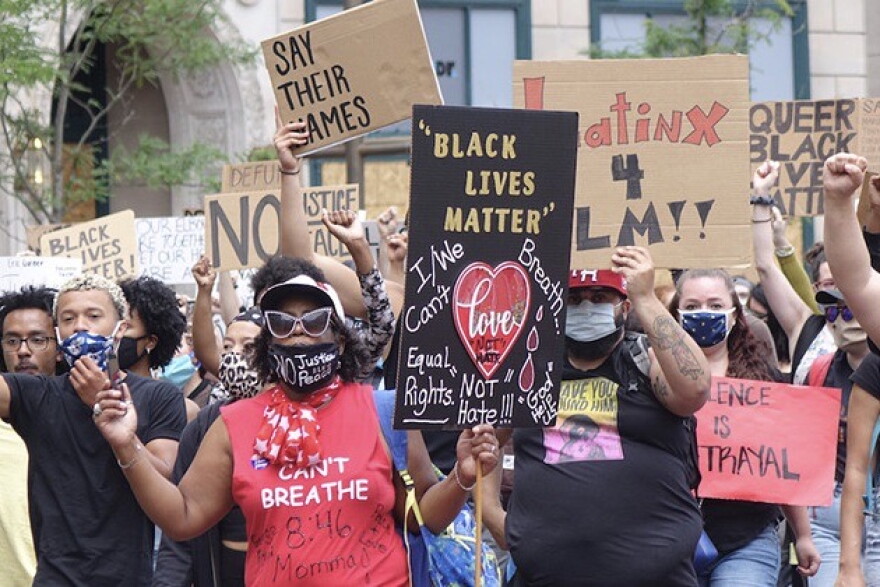 A rally organized by the Indiana Racial Justice Alliance drew several hundred people to Monument Circle on Saturday, June 13, 2020. The group wants the city to reduce the budget of IMPD and reinvest the funds in new community-led initiatives.