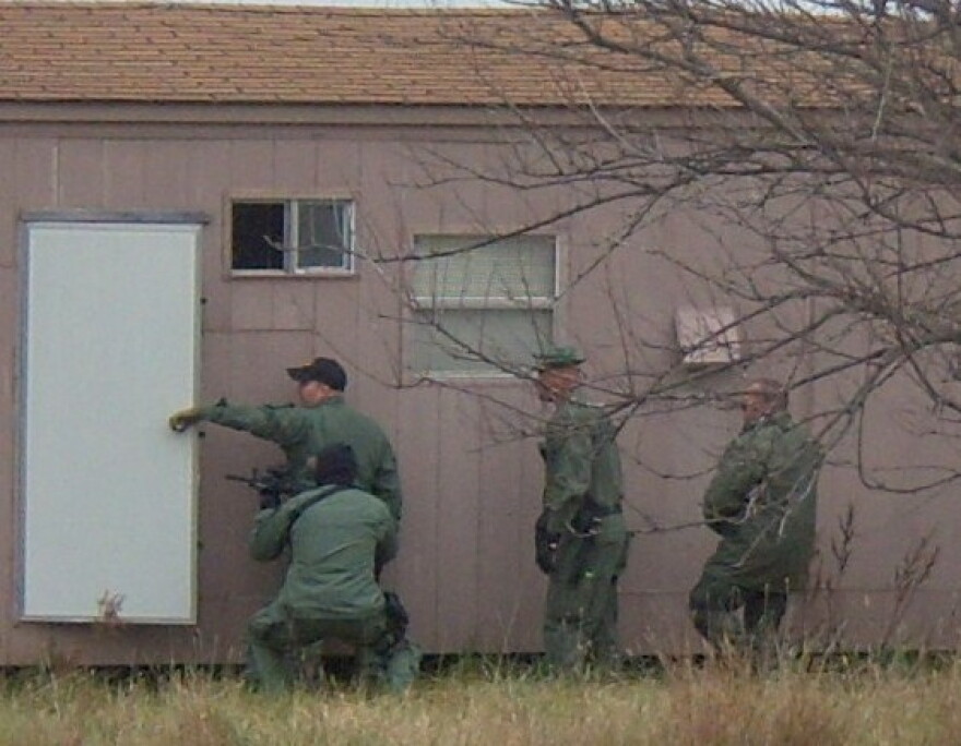 Agents raid a mobile home at Stillwater.