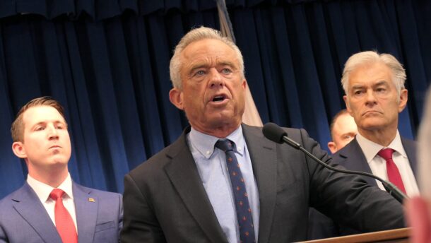Health and Human Services Secretary Robert F. Kennedy Jr. speaks at a news conference on May 21, 2026, in Minneapolis with Centers for Medicare and Medicaid Services Administrator Dr. Mehmet Oz, right, and law enforcement officials to announce charges against 15 people for allegedly defrauding Medicaid programs of $90 million.