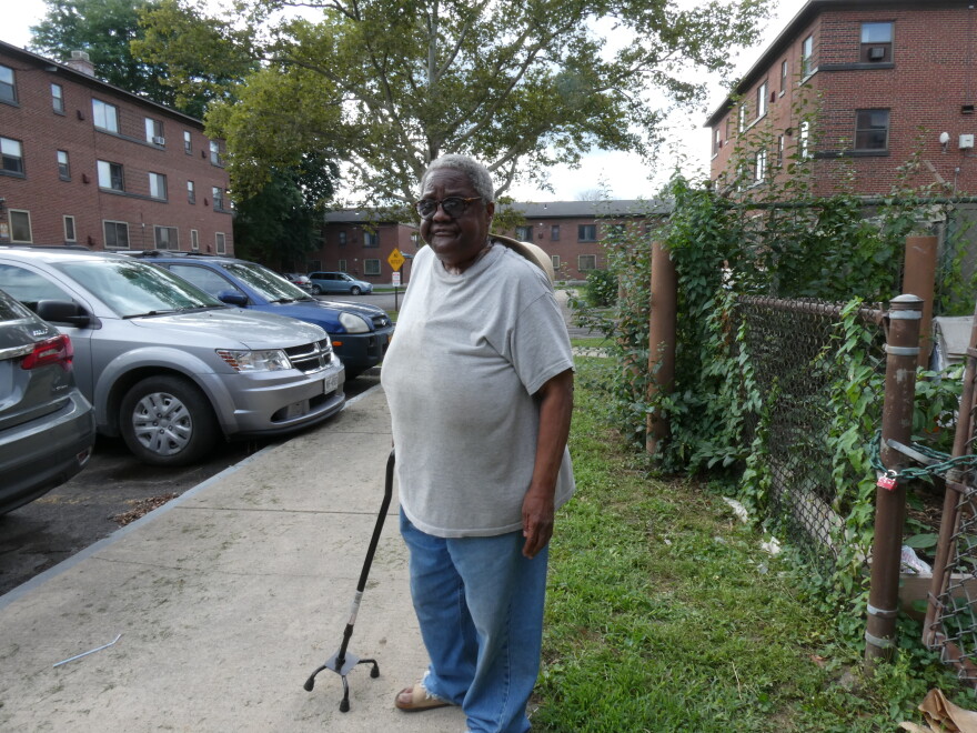 Mable Wilson, a 76 year old resident of the Pioneer Homes public housing complex in Syracuse, uses a cane to balance herself as a result of her hearing issues. The issue could be resolved with hearing aids, which she has gone years without.