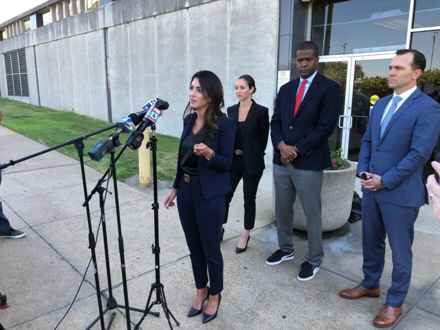 FILE - Attorney Alexandra Benevento, center, speaks with reporters during a news conference announcing a cheerleader abuse lawsuit filed in Tennessee on Tuesday, Sept. 27, 2022, in Memphis, Tenn. The American cheerleading company behind the sport’s top uniforms, camps and competitions is evaluating a possible defamation case against lawyers who have named the enterprise in a series of federal lawsuits alleging sexual abuse at gyms across the Southeast. In a letter sent Tuesday, Nov. 1, defamation attorney Thomas Clare accused civil rights attorney Bakari Sellers and lawyers with the Strom Law Firm of making false and defamatory statements about Varsity Spirit’s relationship to the alleged sexual abuse of cheerleaders by coaches at gyms in South Carolina, Tennessee and North Carolina.