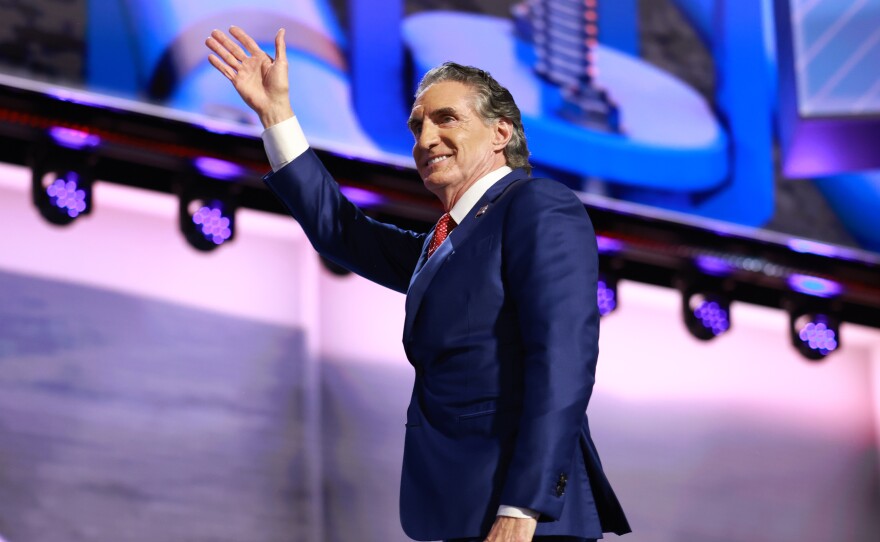 North Dakota Gov. Doug Burgum walks on stage on the third day of the Republican National Convention.