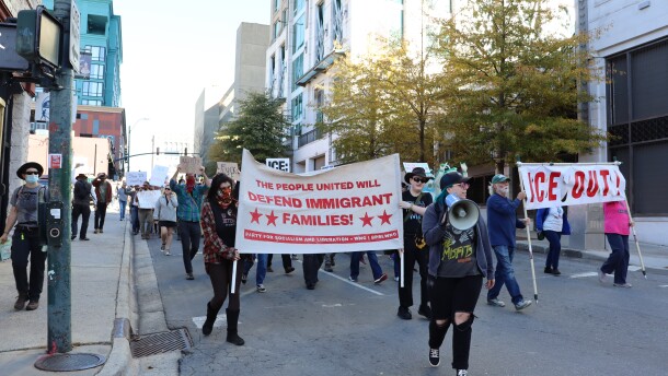Protestors marching on College St. in downtown Asheville on Nov. 16, 2025