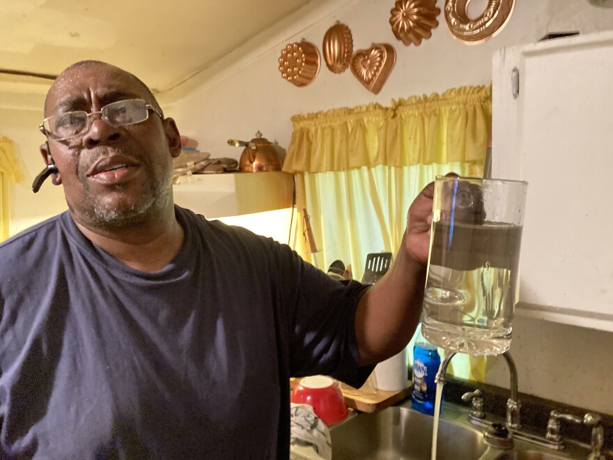 George Reynolds filled a glass of water at his house in Murphy, Miss. April 28, 2021.