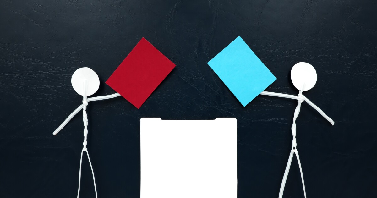 Stick man figures holding red and blue paper ballots on opposite sides of a ballot box