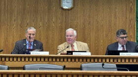 Sen. Sam Hunt presides over a committee hearing on his mandatory voting bill.