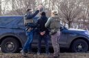 Immigration and Customs Enforcement agents search the passenger of a truck as they arrest both him and the driver during a February traffic stop in Robbinsdale, Minnesota. Minnesota faced a high rate of street arrests after Trump administration officials criticized the state’s sanctuary policies, but even states without such policies have seen street raids to round up immigrants.