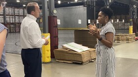 Lt. Gov. Juliana Stratton talks with Midwest Food Bank COO and CFO Eric Hodel during a visit to the Normal facility on Tuesday.