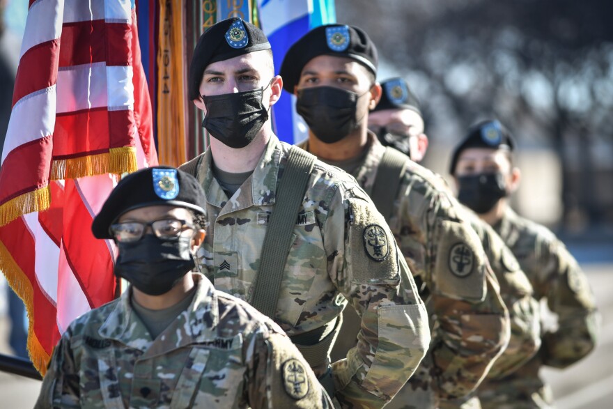 Members of the Munson Army Health Center color guard wait for their moment to present the colors during the Veterans Day ceremony at the World War I Museum on Wednesday.