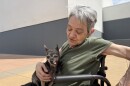 Stead resident Cecilia Leal-Covey evacuated from the Hawk Fire with her dad and chihuahua, Lola, on Aug. 22, 2026. They slept at the evacuation site at the Reno-Sparks Convention Center and planned to stay for several nights.