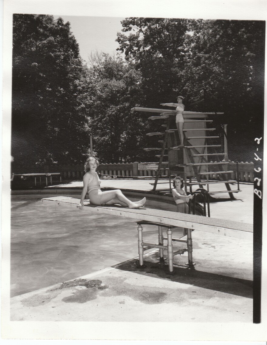 Three women posing at the Moores Park Pool diving boards