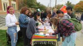Students from Miami's Latiné Student Alliance rally for and gather signatures