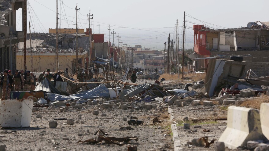 A scene of the extensive damage in the northern Iraqi town of Sinjar. Kurdish fighters entered the town Friday and raised their flag after driving out the Islamic State fighters who overran it last year.