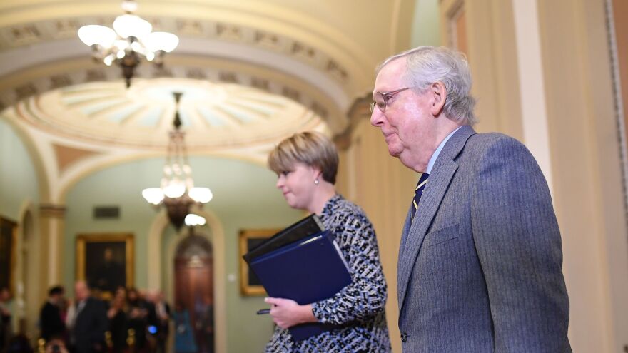 Senate Majority Leader Mitch McConnell walks back to the Senate chamber after a break for the closing arguments in the impeachment trial of President Trump on Monday.