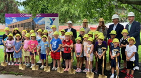 Kids in the Two Rivers YMCA summer day camp take part in a special groundbreaking, with Y leaders outside the Moline facility on Tuesday, Aug. 11, 2026.