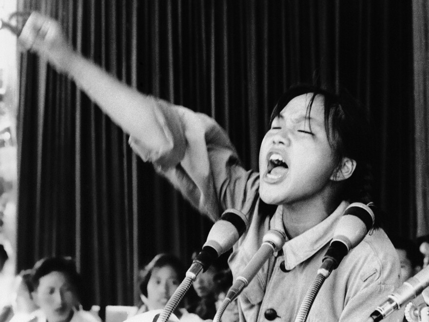Miss Cho, a 15-year-old high school student and Red Guard leader, exhorts her fellow students during a rally held in Beijing's Tiananmen Square in 1966.