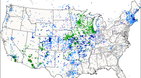 A map of the United States with multicolored dots showing precipitation amounts.