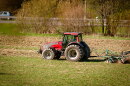 A red tractor on a farm field