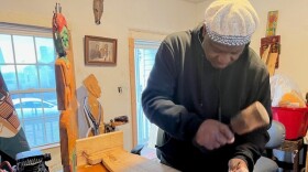 LaVon Williams, Jr. carving his latest panel in his Lexington art studio