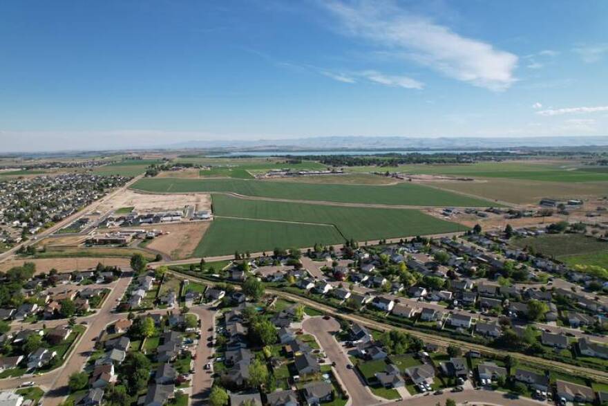 The farmland in the center comprises 282 acres south of Caldwell bought at state auction by Meridian home builder Corey Barton. Lake Lowell is in the distance