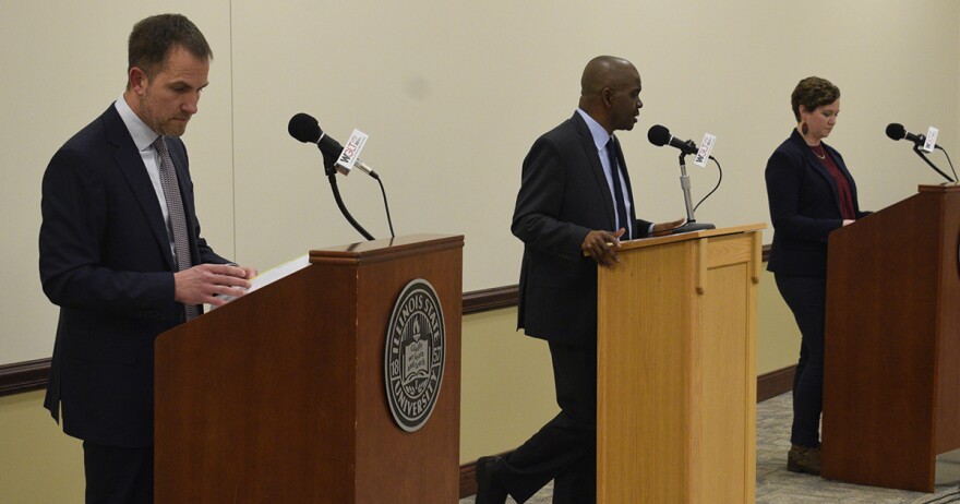 Bloomington mayoral candidates stand at podiums