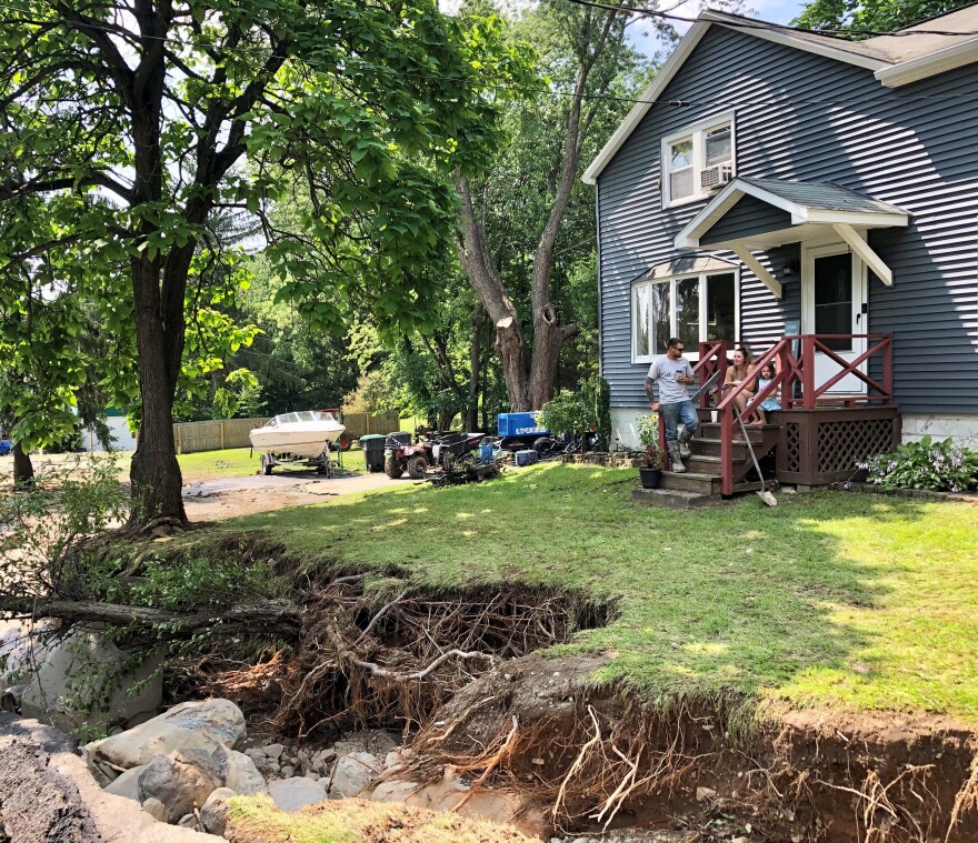 The Bell Family on the front porch of their storm-ravaged Taborton Rd. property.