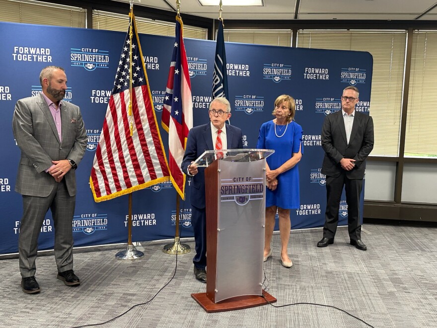 Gov. Mike DeWine, center, urged parents to send their students back to school in Springfield. He said security is heightened but also all threats have been so far been unfounded.