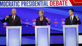Democratic presidential candidate former Vice President Joe Biden, left, Sen. Elizabeth Warren, D-Mass., center and South Bend Mayor Pete Buttigieg speak during a Democratic presidential primary debate hosted by CNN/New York Times at Otterbein University, Tuesday, Oct. 15, 2019, in Westerville, Ohio. (John Minchillo/AP)