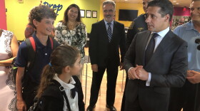 Superintendent Alberto Carvalho, right, talks to iPrep Academy students and siblings Max and Hanna Sultz. Monday was the first day of school.
