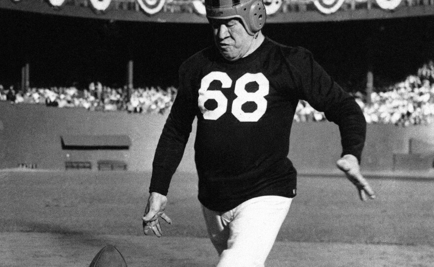 FILE - Jim Thorpe, famous all-around athlete, is shown giving a drop-kicking exhibition at New York's polo grounds on Sept. 26, 1948, between halves of the Israel-U.S. international soccer match. (AP Photo, File)